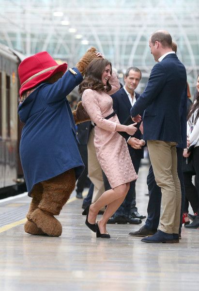 Catherine, Duchess of Cambridge dances with Paddington bear