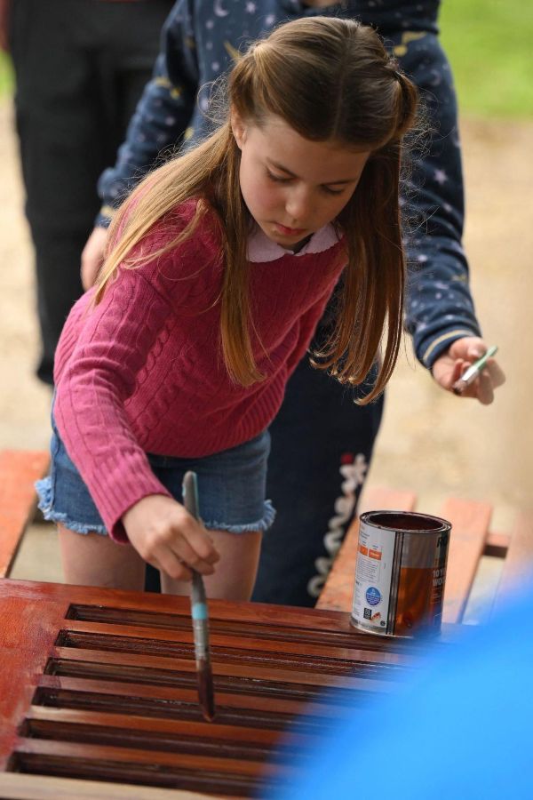 Princess Charlotte stains some wood (1)